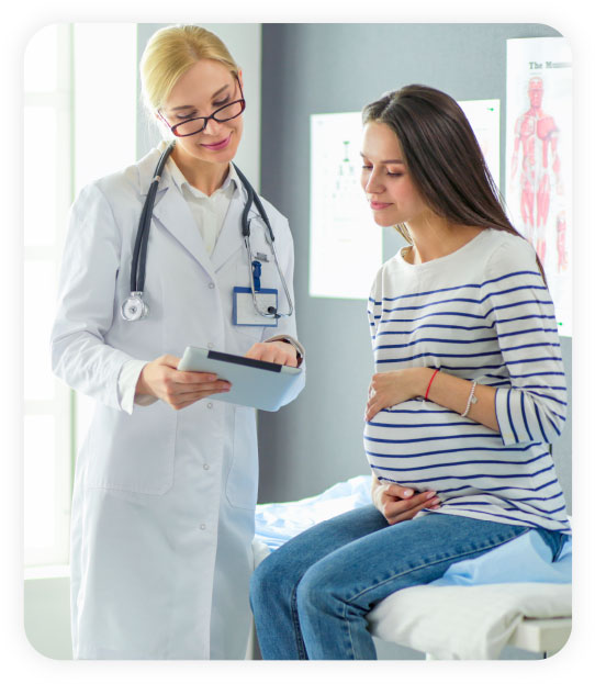 Medical provider showing information to a pregnant woman
